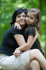 Image showing Daughter embracing her mom