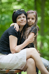 Image showing Daughter embracing her mom