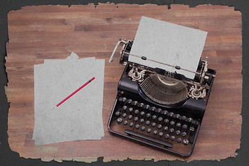 Image showing Vintage typewriter and old books