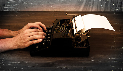 Image showing Writer or reporter behind the typewriter