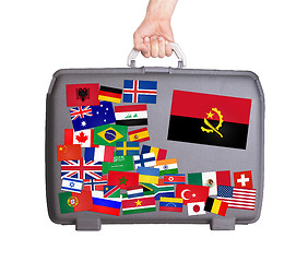 Image showing Used plastic suitcase with stickers