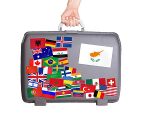 Image showing Used plastic suitcase with stickers