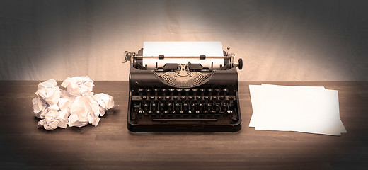 Image showing Vintage typewriter and old books