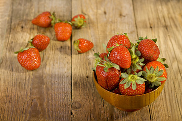 Image showing Fresh strawberries in wood bowl 