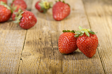 Image showing Fresh strawberries on wooden table