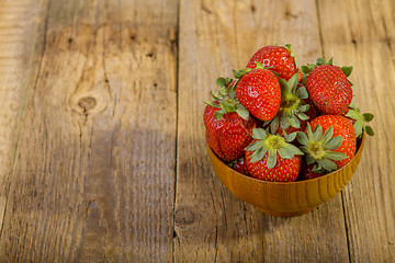 Image showing Fresh strawberries in wood bowl 