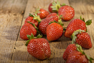 Image showing Close up of strawberries on wood