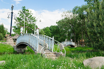 Image showing antique white bridge with spectacular park lights