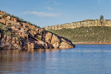 Image showing mountain lake with sandstone cliffs