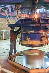 Image showing Worker making circle block on equipment