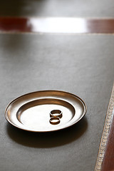 Image showing Wedding rings on a plate in the registry office