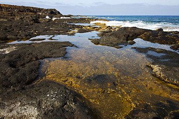 Image showing beach  light     lanzarote foam rock spain    stone sky cloud   