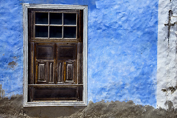 Image showing  brown wood   window in a blue wall arrecife 