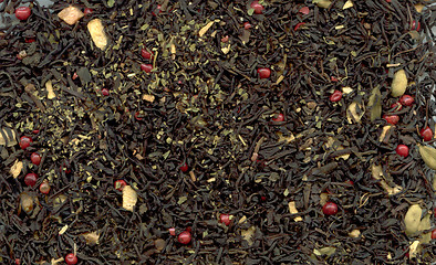 Image showing Indian masala tea with pink peppercorn as background