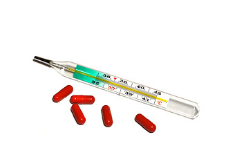 Image showing Medical thermometer and pills