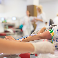 Image showing Nurse and blood donor at donation.