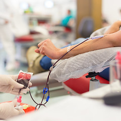 Image showing Nurse and blood donor at donation.