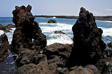 Image showing rock spain   beach water   lanzarote  isle foam  landscape  ston