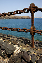 Image showing rusty chain  water  boat  and summer in lanzarote spain