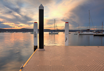 Image showing Boats and yachts moored at sunset