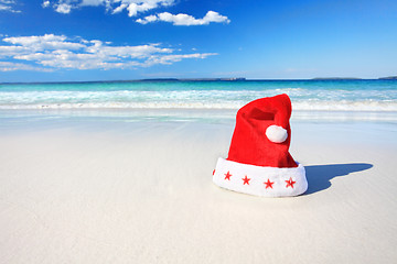 Image showing Christmas Santa hat on sunny beach in Australia