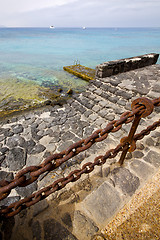 Image showing pier rusty chain  water  in lanzarote spain