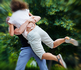 Image showing Man lifts up girl