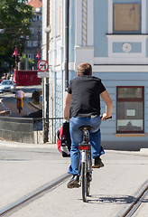Image showing Man on bike in city