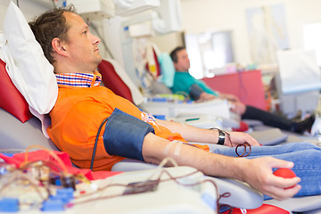 Image showing Blood donor at donation.