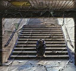 Image showing Lonely man sitting on the stairs