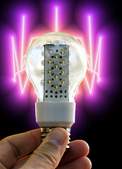 Image showing Light bulb held in palm