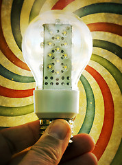 Image showing Light bulb held in palm