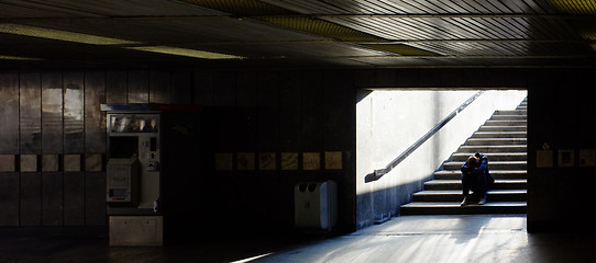 Image showing Lonely man sitting on the stairs