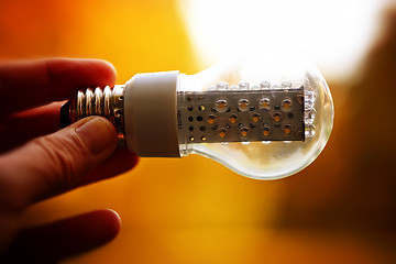 Image showing Light bulb held in palm