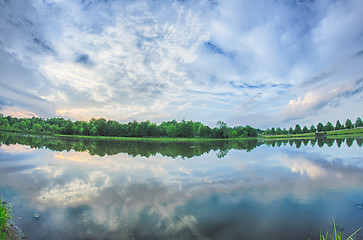 Image showing sun setting over a reflective lake