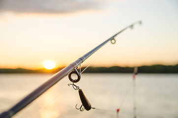 Image showing fishing on a lake before sunset