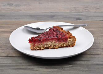 Image showing Red currant cake on wood