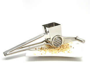 Image showing Grater with hazelnuts