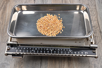 Image showing Old kitchen scales on wood