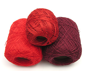 Image showing Red balls of wool  on a white background