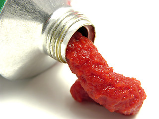 Image showing Tomato puree pressed out of a tomato tube