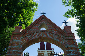 Image showing gothic church gate with metallic crosses  