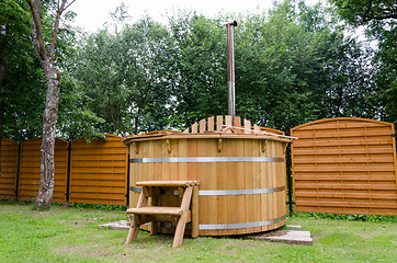 Image showing rural wooden water hot tub with stairs garden yard 