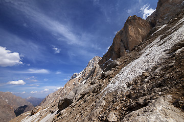 Image showing Rocks with snow at sun day