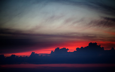 Image showing Dark sunrise sky on lake