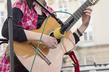 Image showing Woman playing guitar