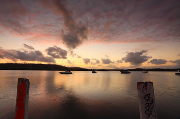 Image showing Relaxing on the jetty watching the beautiful sunset