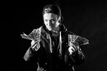 Image showing a young man with money in hands