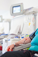 Image showing Blood donor at donation.