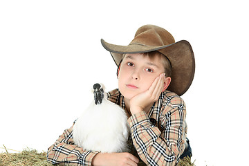 Image showing Country boy with farm animal with copyspace
